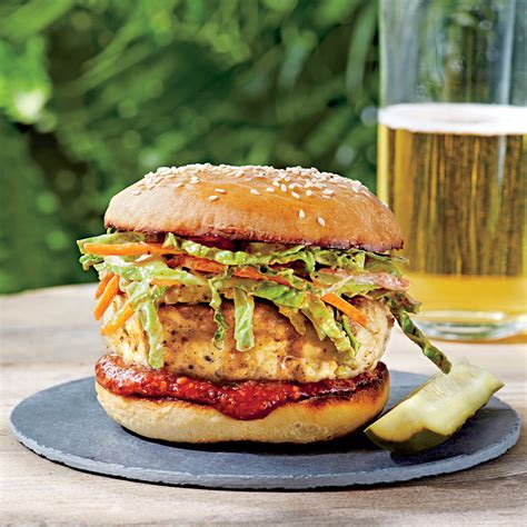 These chicken burgers get a delicious hint of sweetness with tart apples mixed right into the patties. Carolina Chicken Burgers with Ancho Slaw Recipe | MyRecipes