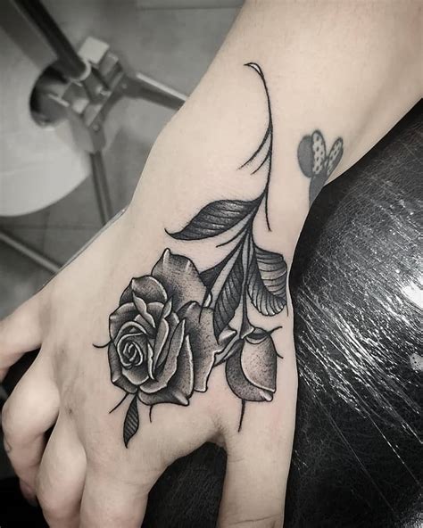 Rose Hand Tattoo Updated 35 Beautiful Black Rose Tattoo Designs