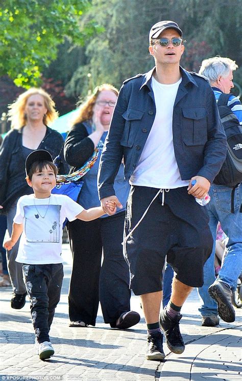 Maybe you would like to learn more about one of these? Orlando Bloom and son Flynn sample Disneyland rides ...