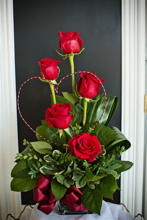 a stunning and unique valentine s day arrangement created with red roses greenery an… rose