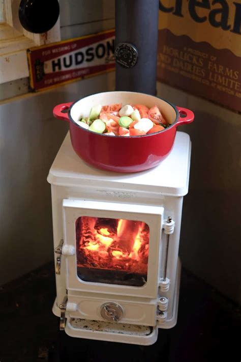 Turn Your Tiny Wood Stove Into A Tiny Cookstove With A Cast Iron Cook Pot