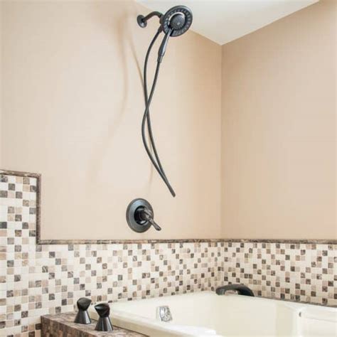 Shower stall kits work well when you are replacing bathtubs in alcoves. Three Ways to Add a Shower to a Tub - The Handyman's Daughter