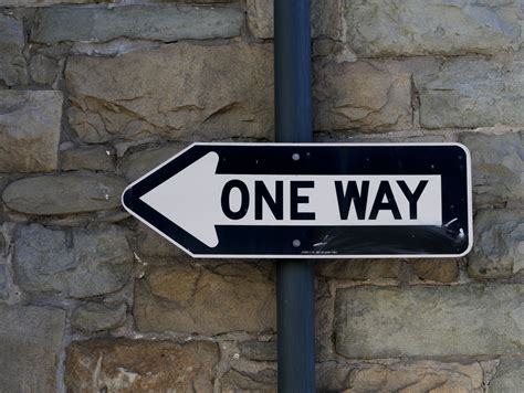 One Way Sign Against Stone Wall Free Stock Photo Public Domain Pictures