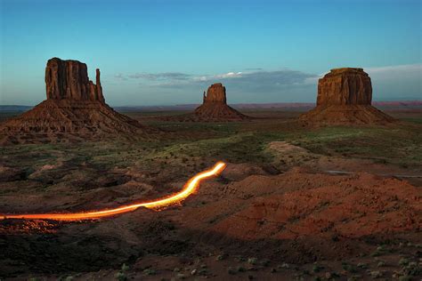 Driving Through Monument Valley At Dusk Photograph By Gregory Ballos
