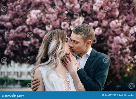 Loving Couple On The Background Of Flowering Trees Kiss Stock Image Image Of Decor Event