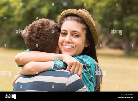 Young Couple Hugging In The Park Stock Photo Alamy