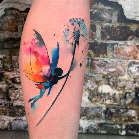 Watercolor Style Fairy And Dandelion Seed Tattoo On The