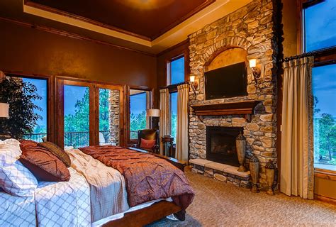 Master Bedroom With Custom Stone Fireplace Including Beautiful Views