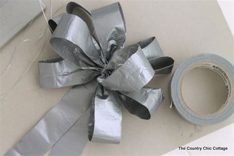 A Roll Of Duct Tape Next To A Silver Ribbon