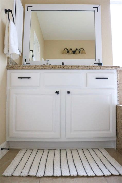 White paint is a timeless and versatile choice that adds a refreshing element of style and sophistication to your bathroom. DIY Painted Cabinets #DIY #PaintedCabinets | Painting ...