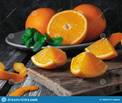 Juicy Orange Slices In The Background Is A Plate With