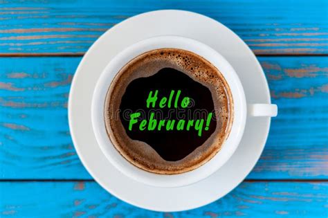 Hello February Inspiration In Notepad Near Cup Of Morning Coffee At