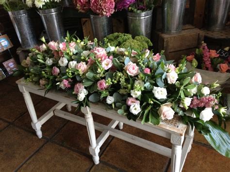 If the deceased served in a branch of the armed forces, the casket may be covered with a national flag; Mixed Flower Casket Spray - The Cracked Pot Flower Boutique