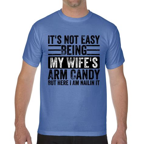 it s not easy being my wife s arm candy but here i am nailin comfort colors t shirt teeshirtpalace