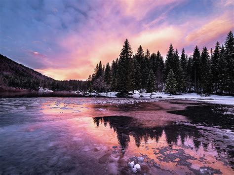 Lago Di Fusine In Italy During Winter At Sunset Photograph By Kristian