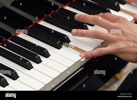 Hand Playing The Piano Stock Photo Alamy
