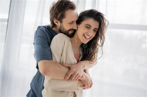 Overjoyed Man Hugging Brunette Girlfriend At Stock Image Image Of