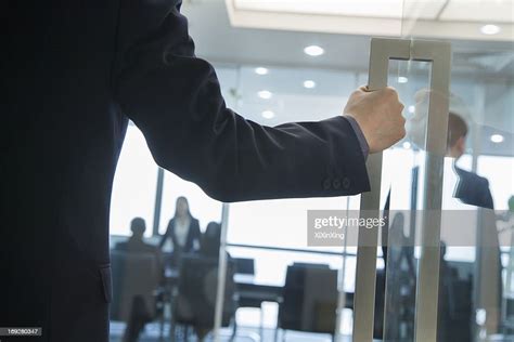 Businessman Entering An Office High Res Stock Photo Getty Images