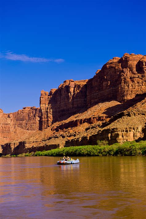 a wilderness river adventures motorized pontoon rafting down the meander canyon section of the