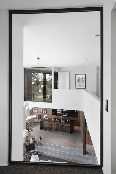 An Open Living Room And Dining Area Are Seen Through The Glass Doors On