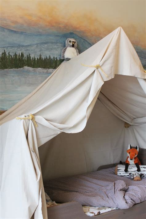Bed tents are a great way to make kid's nights more personal and fun by giving them their own space and letting them control their own privacy. Remodelaholic | Camping Tent Bed in a Kid's Woodland Bedroom