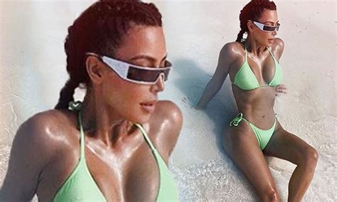 Kim Kardashian Shows Off Tiny Waist In A Neon Green Bikini Daily Mail