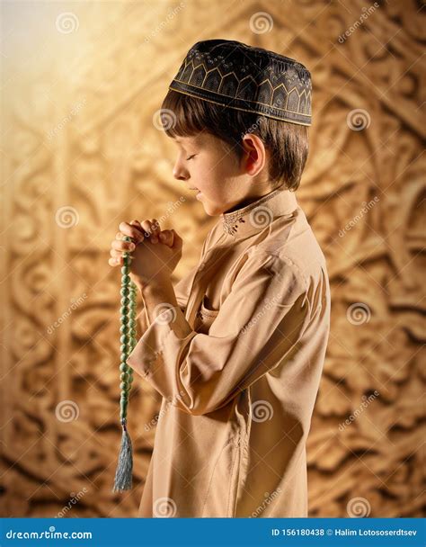 Little Muslim Boy With Rosary Beads Praying To God Stock Photo Image