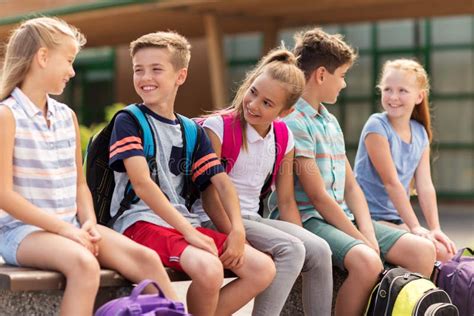 Group Of Happy Elementary School Students Talking Stock Photo Image