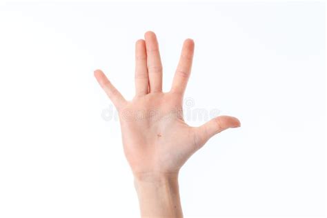 A Mão Fêmea Esticada Acima E Mostrando O Gesto Com Os Dedos é Isolada Em Um Fundo Branco Foto De