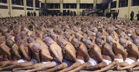 Photos Of Prisoners Stripped Half Naked Sitting Tightly In Lines
