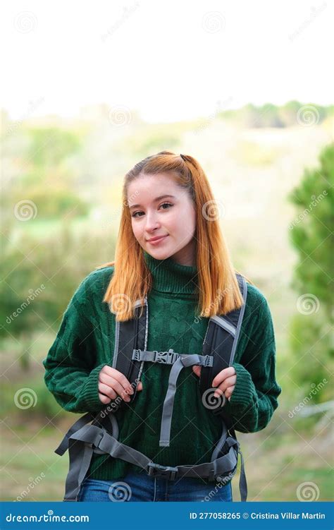 Smiley Hiker Redhead Young Woman Posing Looking At Camera Wearing A
