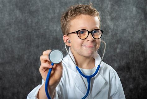 Cute Kid Boy Wear Medical Uniform Playing Doctor Portrait Stock Image
