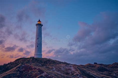 White Lighthouse In The Dunes Of The Danish North Sea Coast Stock Photo