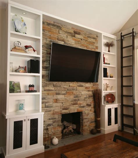 Extra charges apply for patching the wall where the unit and surround were installed. Toronto Fireplace Wallunit TV Renovation