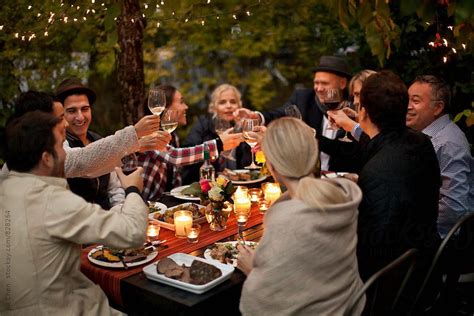 For some, it's the image of a family sitting around a big feast—a pleasant, calm scene. Outdoor Dinner Party by Jill Chen for Stocksy United ...