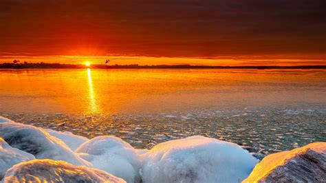 Frozen Rock Under Black Red Cloudy Sky During Sunset 4k Hd