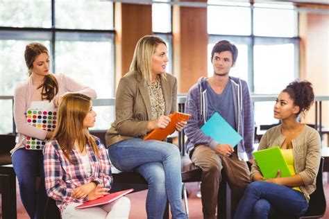 Happy Students Talking With Their Teacher Stock Photo Image Of