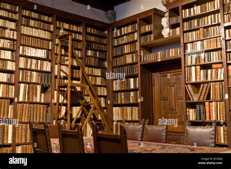 Shelves Full Of Antique Books In The Library Of Plantin Moretus Stock