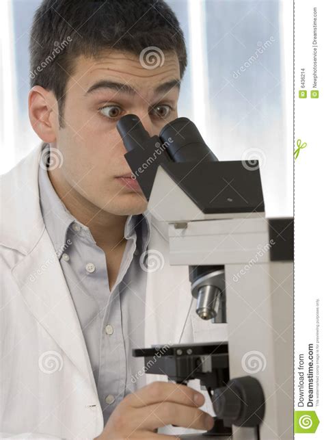 Young Scientist Watching Inside A Microscope Stock Images Image 6436214