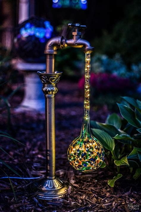 Solar lights are a great way to be energy efficient as well as light up your garden or lawn. DIY Waterdrop Solar Garden Lights - The Navage Patch