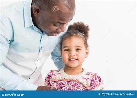 Portrait Of A Young Father With His Daughter On White Background Stock