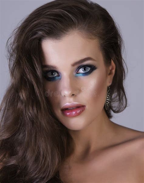 Portrait Of A Young Brunette Girl With Shiny Makeup Stock Photo Image