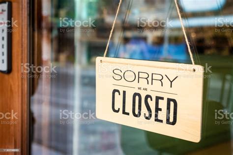 Sorry We Are Closed Sign Board Hanging On Door Of Cafe Stock Photo
