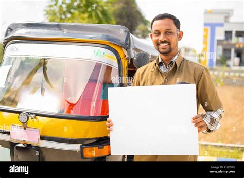 Happy Smiling Auto Driver With Empty White Sign Board Looking At Camera