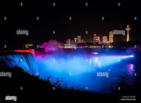 Niagara Falls Illuminated With Color Lights At Night View Stock Photo