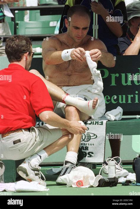 Andre Agassi Of The Us Puts His Sock Back On March 31 After An
