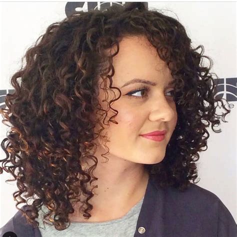 The cut will add volume to the hair and will also give you a clean look. 30 Best Curly Hairstyles for Medium Hair - BelleTag