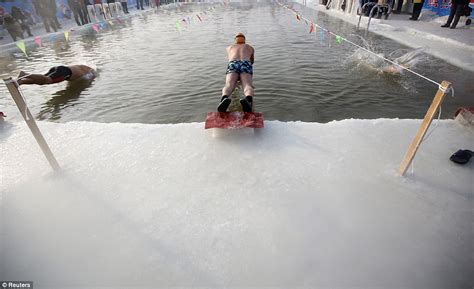 Over 700 Swimmers Take The Plunge Into 27c Pool Carved Out Of Ice