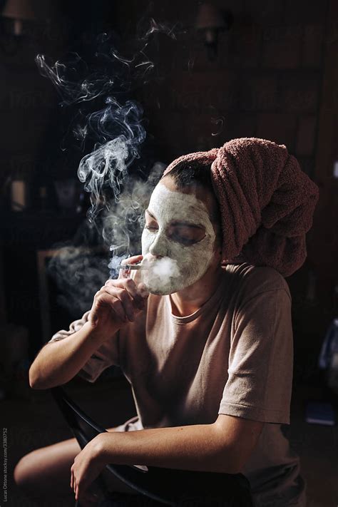 Creepy Woman Smoking By Stocksy Contributor Lucas Ottone Stocksy