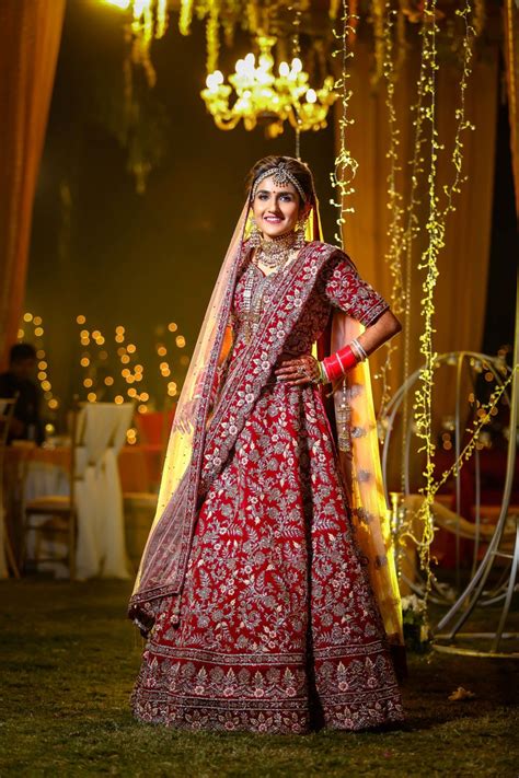 Photo Of Beautiful North Indian Bride Looking Stunning In Red Bridal Lehenga
